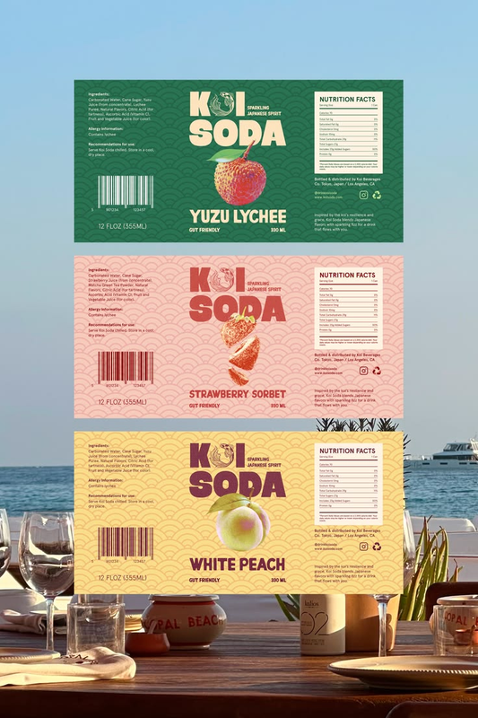 Three colourful soda nutrition labels displayed above an outdoor dining table by the sea.
